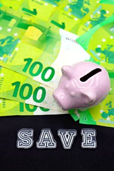 Pink piggy bank on Euro banknotes with 'SAVE' text, symbolizing financial savings.
